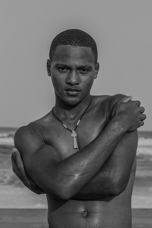 Strength and Serenity — black-and-white portrait, arms crossed, quiet strength and resilience
